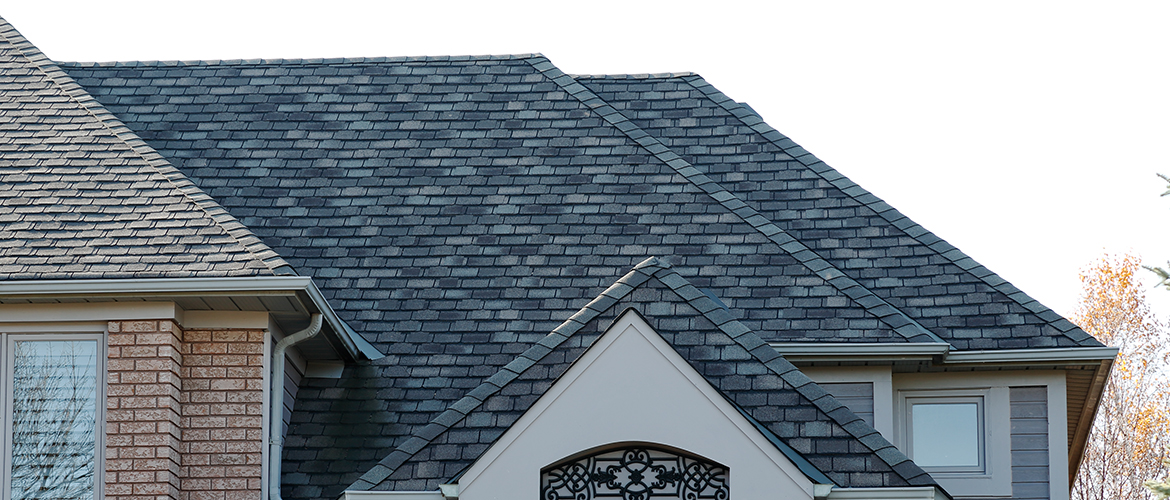 Grand professional roofing company team on a large roof