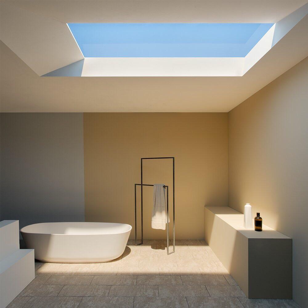 Modern bathroom with large skylight providing natural light